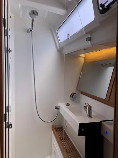  Yacht Photos Pics 2024 Jeanneau Sun Odyssey 440 bathroom with modern fixtures and sleek design.