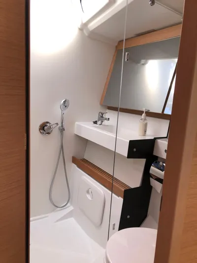  Yacht Photos Pics 2024 Jeanneau Sun Odyssey 440 bathroom with modern fixtures and sleek design.
