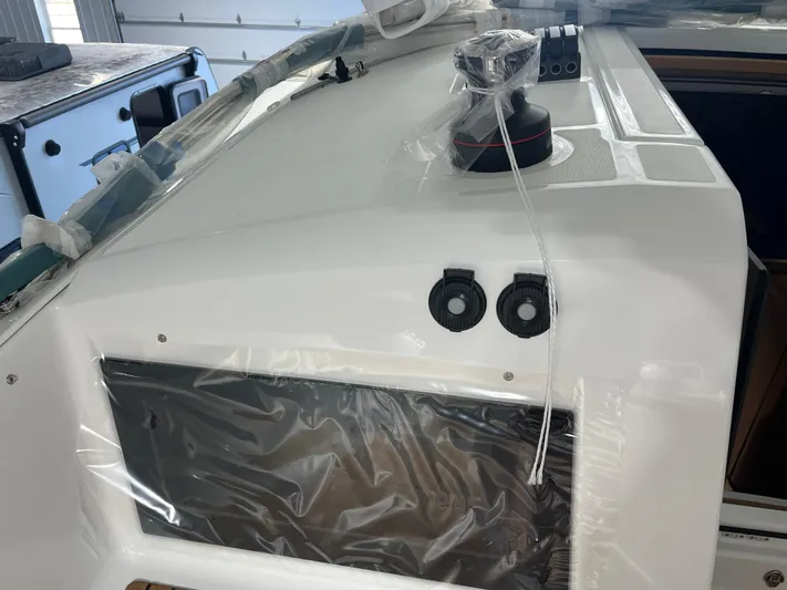  Yacht Photos Pics 2024 Jeanneau Sun Odyssey 440 yacht deck with winch and control panel.