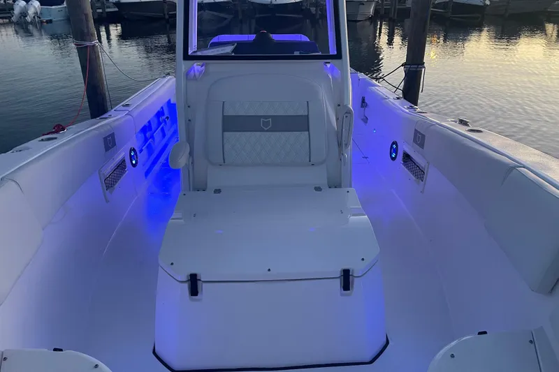  Yacht Photos Pics 2026 Sea Fox 268 Commander boat interior with blue LED lighting at a marina.