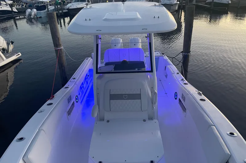  Yacht Photos Pics 2026 Sea Fox 268 Commander boat with illuminated deck at marina.