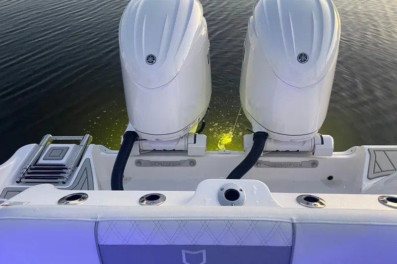  Yacht Photos Pics 2026 Sea Fox 268 Commander boat with dual engines on calm water.