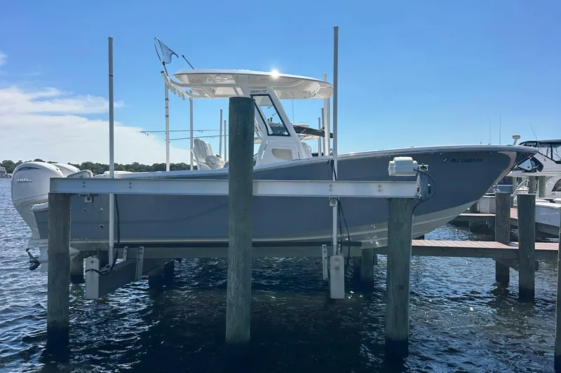  Yacht Photos Pics 2026 Sea Fox 268 Commander boat docked on a lift under a clear blue sky.