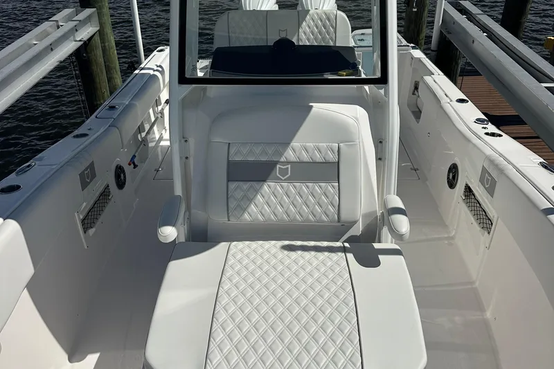  Yacht Photos Pics 2026 Sea Fox 268 Commander boat interior with white quilted seating and sleek design.