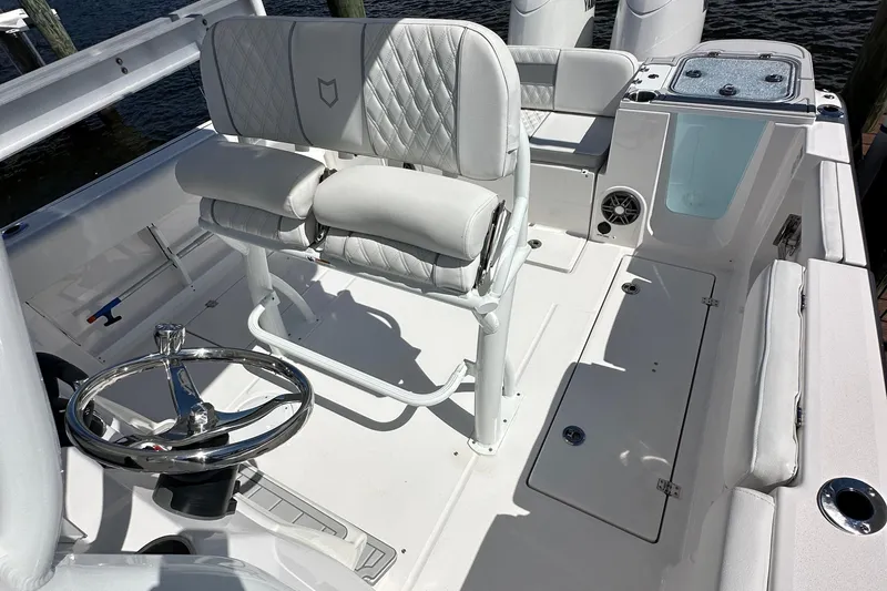  Yacht Photos Pics 2026 Sea Fox 268 Commander boat interior with helm, seating, and storage compartments.