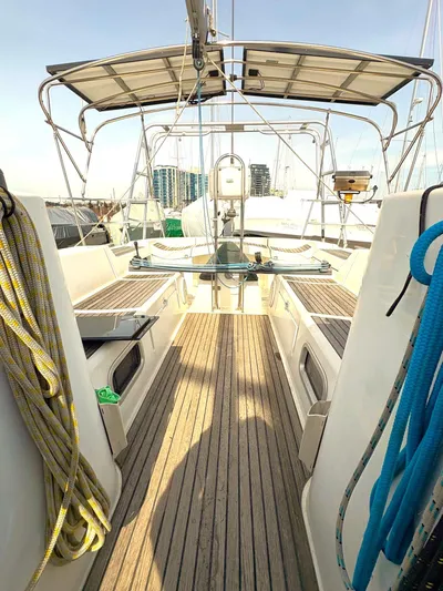 Brown Sugar Yacht Photos Pics 2005 Beneteau First 47.7 sailboat cockpit with teak decking and rigging ropes.