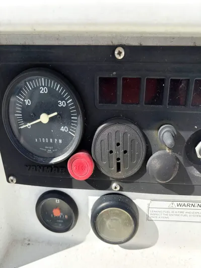 Brown Sugar Yacht Photos Pics Control panel of a 2005 Beneteau First 47.7 sailboat with gauges and buttons.