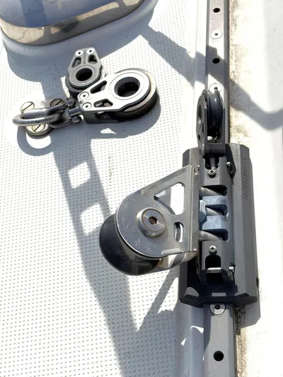 Brown Sugar Yacht Photos Pics Sailing hardware on 2005 Beneteau First 47.7 yacht deck, featuring pulleys and blocks.