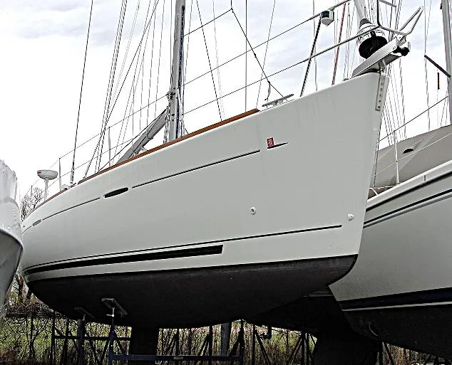 Brown Sugar Yacht Photos Pics 2005 Beneteau First 47.7 sailboat on dry dock, showcasing sleek hull design.