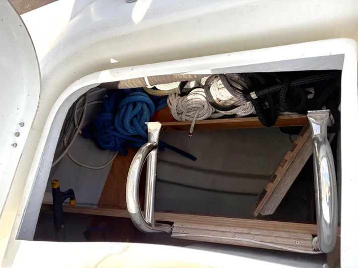 Brown Sugar Yacht Photos Pics Storage compartment on a 2005 Beneteau First 47.7 sailboat with coiled ropes.