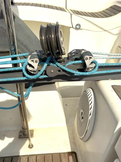 Brown Sugar Yacht Photos Pics Deck equipment on a 2005 Beneteau First 47.7 sailboat with blue ropes and pulleys.