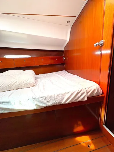 Brown Sugar Yacht Photos Pics Cozy cabin interior of 2005 Beneteau First 47.7 sailboat with wooden finish.