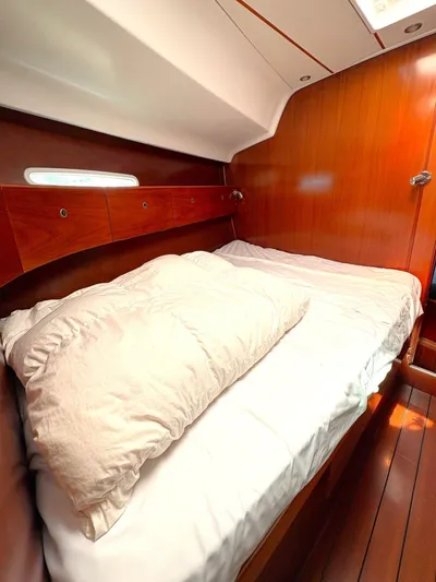 Brown Sugar Yacht Photos Pics Cozy cabin interior of 2005 Beneteau First 47.7 sailboat with wooden finish.
