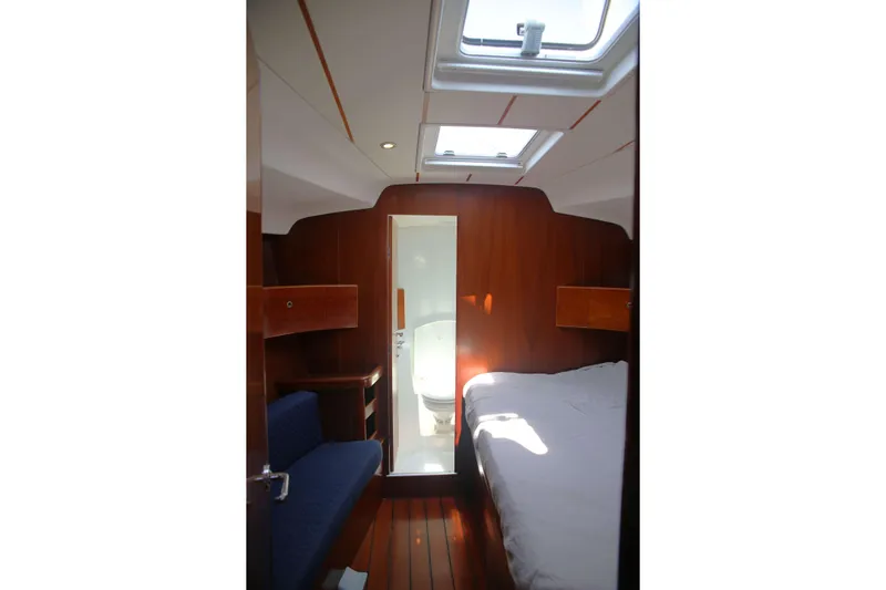 Brown Sugar Yacht Photos Pics Interior cabin of 2005 Beneteau First 47.7 yacht with wooden finish and skylight.