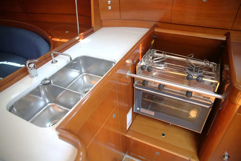 Brown Sugar Yacht Photos Pics Galley kitchen in 2005 Beneteau First 47.7 yacht with stove and double sink.
