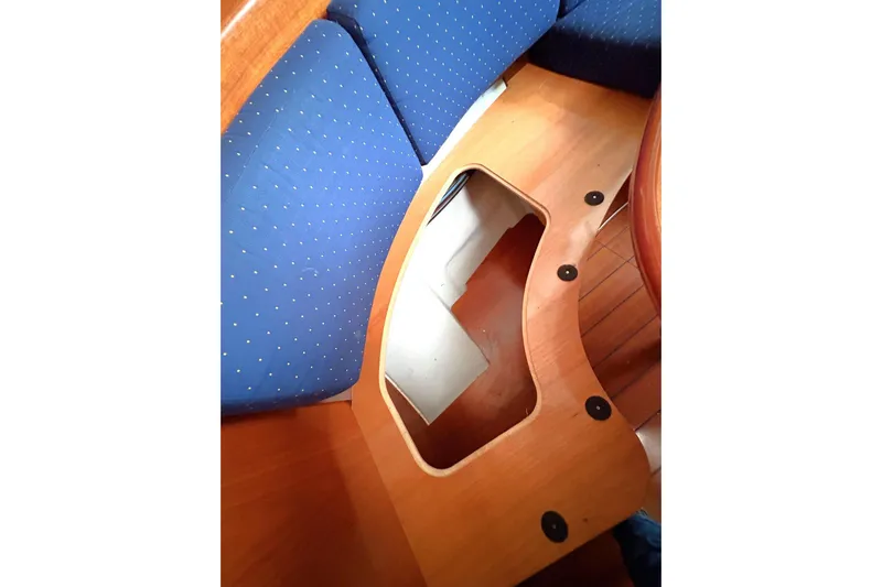 Brown Sugar Yacht Photos Pics Interior view of 2005 Beneteau First 47.7 sailboat with blue cushioned seating.