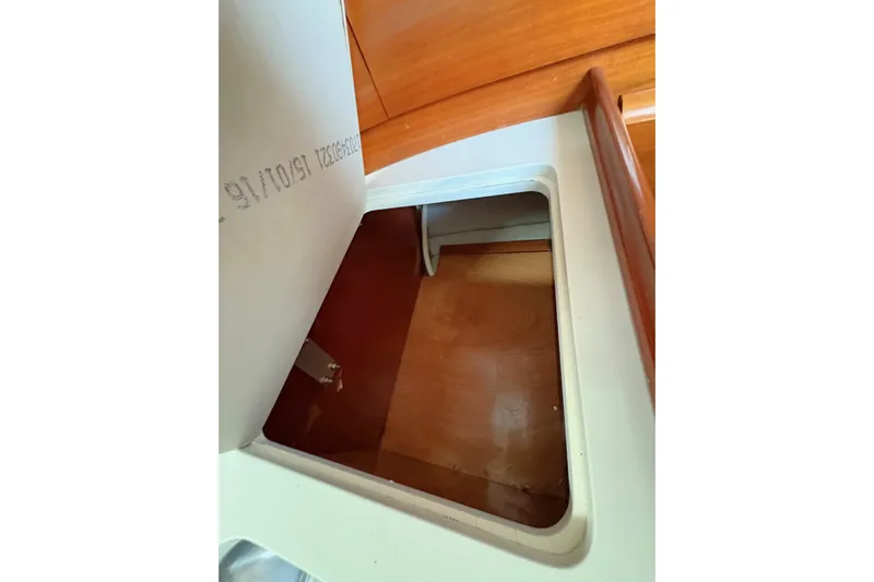Brown Sugar Yacht Photos Pics Open storage compartment on 2005 Beneteau First 47.7 sailboat interior.