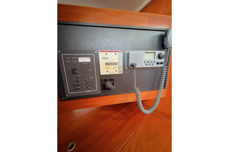 Brown Sugar Yacht Photos Pics Control panel on a 2005 Beneteau First 47.7 yacht, featuring communication and power systems.