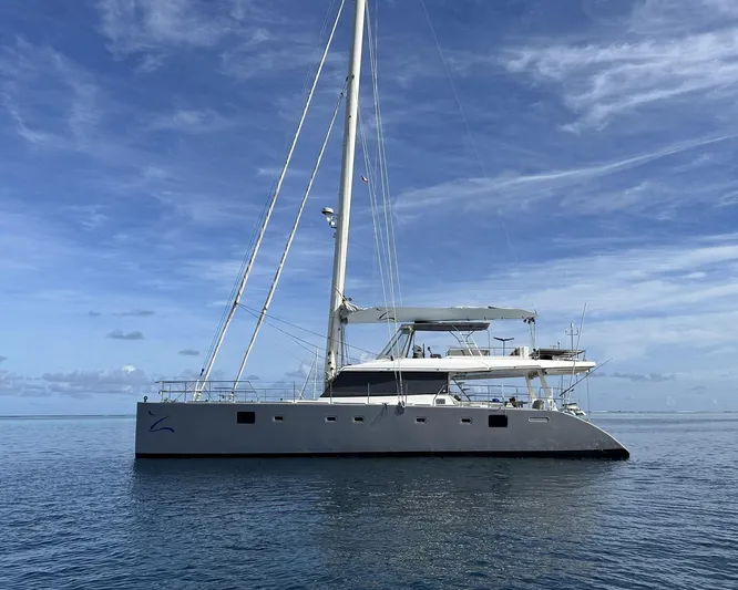 Zahora Yacht Photos Pics 2008 Sunreef 62 catamaran sailing on calm ocean under blue sky.