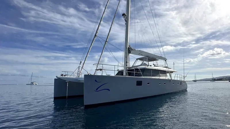 Zahora Yacht Photos Pics 2008 Sunreef 62 catamaran sailing on calm waters under a cloudy sky.