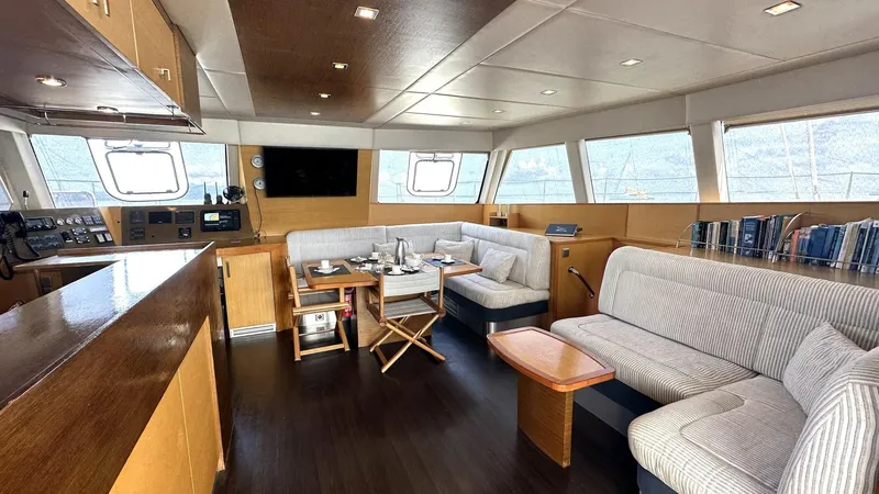 Zahora Yacht Photos Pics Luxurious interior of 2008 Sunreef 62 yacht with modern seating and dining area.