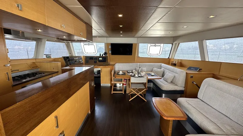 Zahora Yacht Photos Pics Luxurious interior of 2008 Sunreef 62 yacht with modern furnishings and panoramic windows.