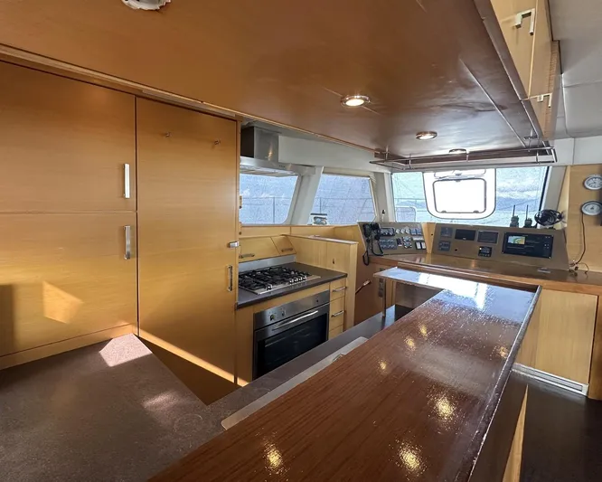 Zahora Yacht Photos Pics Interior of 2008 Sunreef 62 yacht with modern kitchen and navigation area.