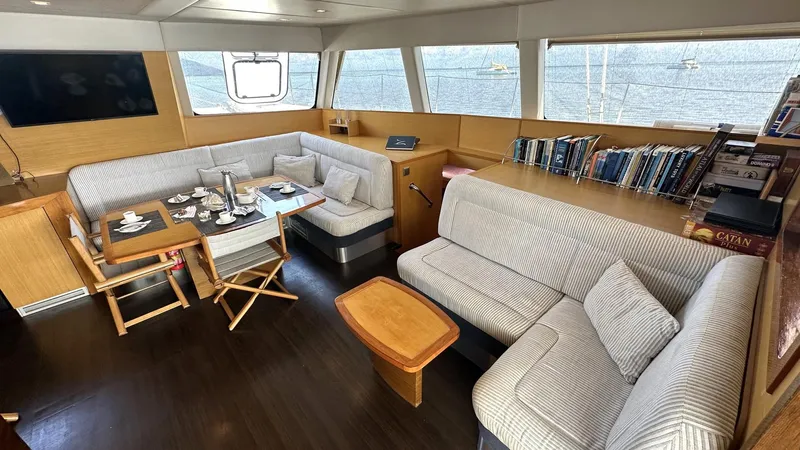 Zahora Yacht Photos Pics Luxurious Sunreef 62 yacht interior, featuring cozy seating, dining area, and panoramic windows, 2008 model.