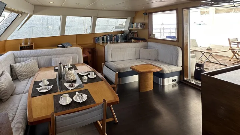 Zahora Yacht Photos Pics Luxurious Sunreef 62 yacht interior, 2008 model, featuring elegant dining and seating area.