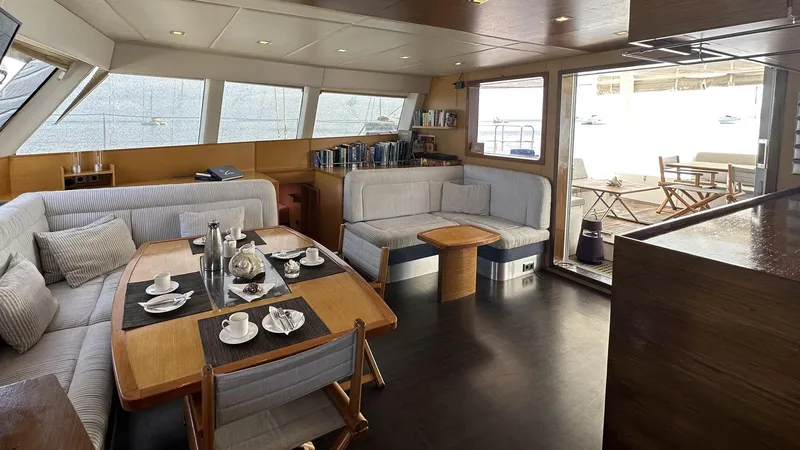 Zahora Yacht Photos Pics Luxurious interior of 2008 Sunreef 62 yacht with elegant dining and seating area.