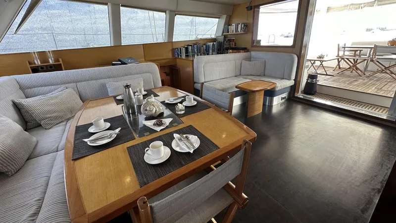 Zahora Yacht Photos Pics Luxurious interior of 2008 Sunreef 62 yacht with elegant dining area and cozy seating.