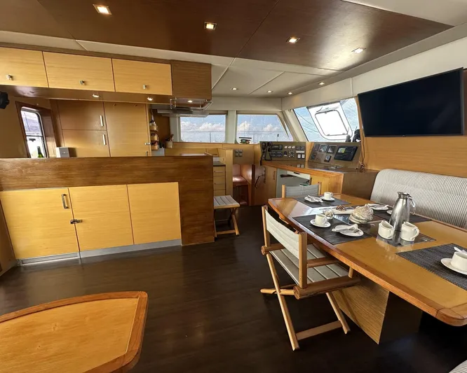 Zahora Yacht Photos Pics Luxurious interior of 2008 Sunreef 62 yacht with modern kitchen and dining area.