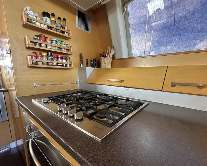 Zahora Yacht Photos Pics Modern kitchen in 2008 Sunreef 62 yacht with gas stove and spice rack.