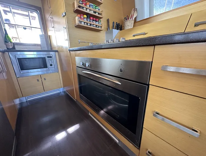 Zahora Yacht Photos Pics Modern kitchen interior of 2008 Sunreef 62 yacht with oven and microwave.