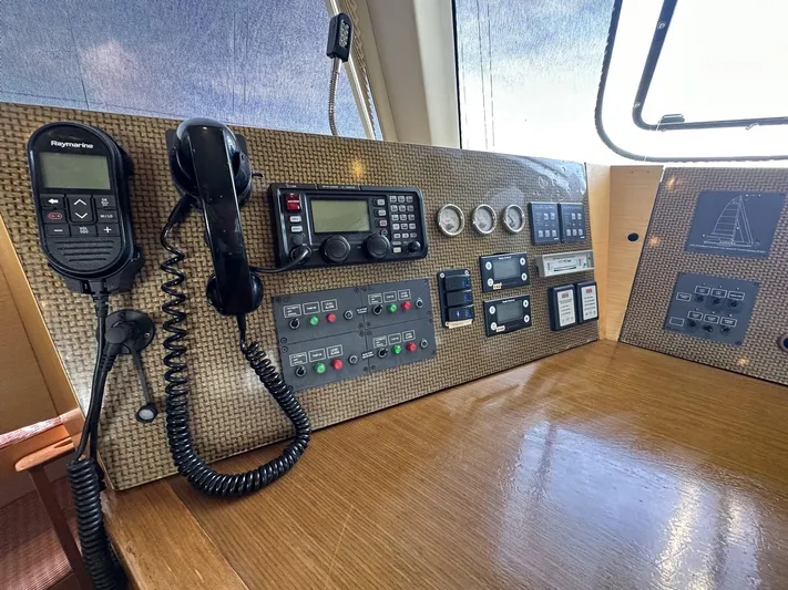 Zahora Yacht Photos Pics Control panel of a 2008 Sunreef 62 yacht with communication devices and gauges.