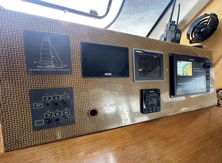 Zahora Yacht Photos Pics Control panel of a 2008 Sunreef 62 yacht with navigation instruments and communication devices.