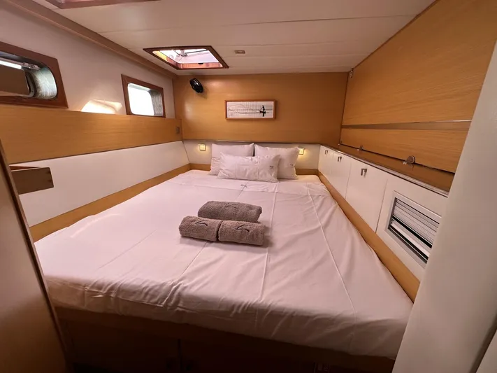Zahora Yacht Photos Pics Luxurious cabin interior of 2008 Sunreef 62 yacht with cozy bed and natural lighting.