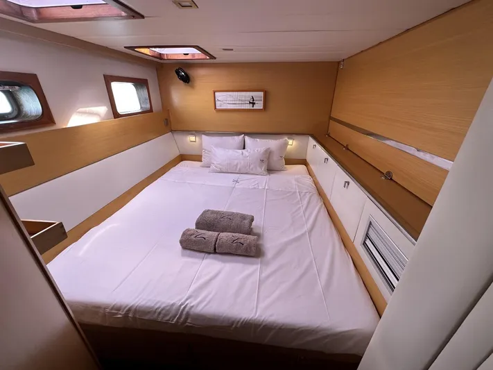 Zahora Yacht Photos Pics Luxurious cabin interior of 2008 Sunreef 62 yacht with cozy bed and natural lighting.