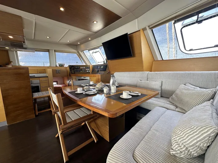 Zahora Yacht Photos Pics Luxurious interior of 2008 Sunreef 62 yacht with dining area and modern amenities.