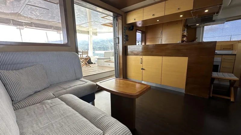 Zahora Yacht Photos Pics Interior of 2008 Sunreef 62 yacht with cozy seating and modern kitchen.