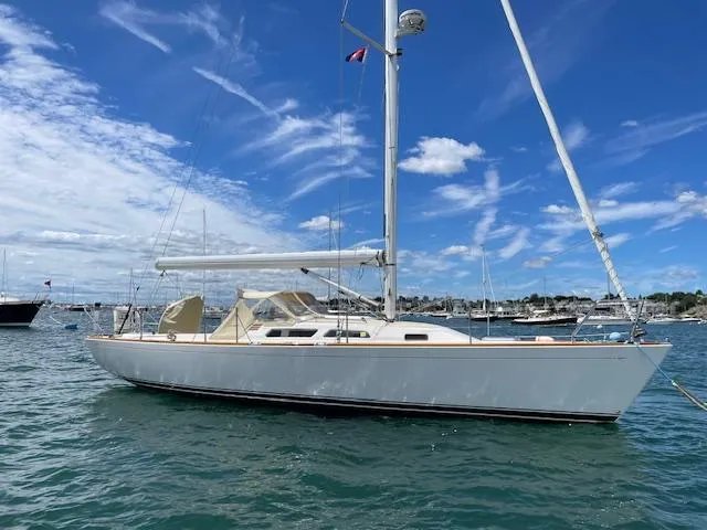 High C's Yacht Photos Pics 2012 Sabre Spirit sailboat on water under blue sky with clouds.