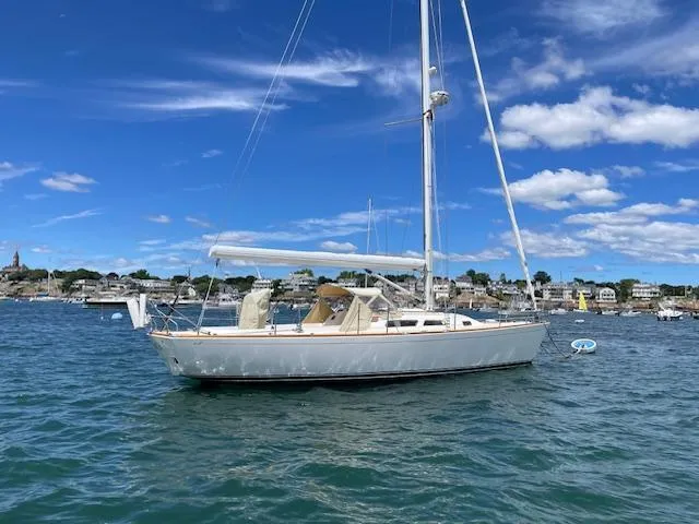 High C's Yacht Photos Pics Sailboat on water, 2012 Sabre Spirit, clear sky, coastal background.