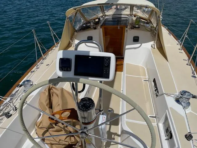 High C's Yacht Photos Pics 2012 Sabre Spirit sailboat cockpit with steering wheel and navigation equipment.