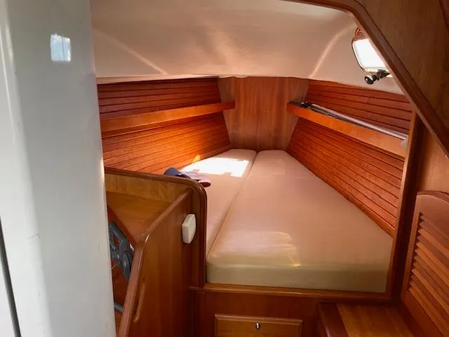 High C's Yacht Photos Pics 2012 Sabre Spirit boat interior with wooden paneling and cozy sleeping area.