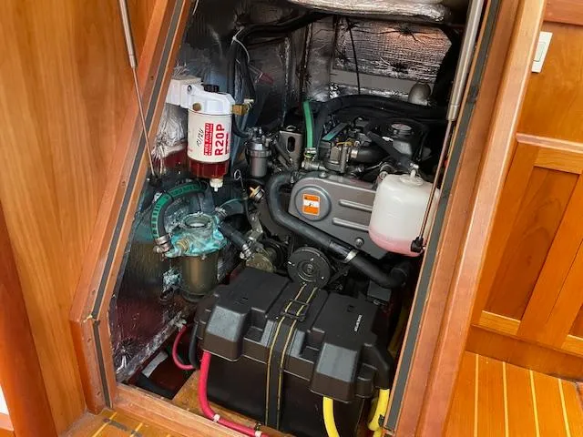 High C's Yacht Photos Pics Engine compartment of a 2012 Sabre Spirit boat, showcasing mechanical components and wiring.