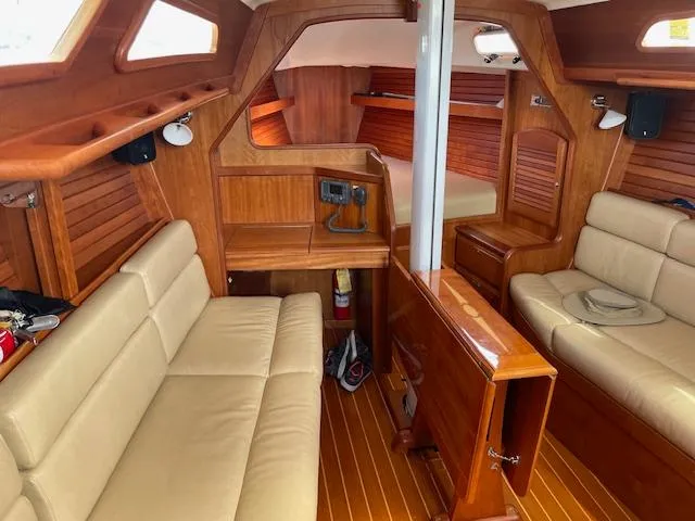 High C's Yacht Photos Pics Interior of 2012 Sabre Spirit sailboat with wooden finish and beige seating.