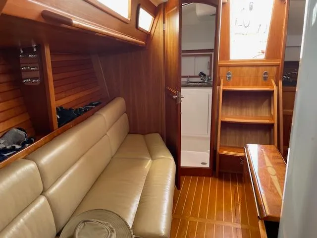 High C's Yacht Photos Pics Interior of 2012 Sabre Spirit yacht with wooden finish and beige seating.