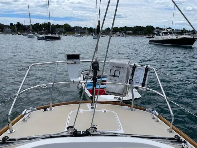 High C's Yacht Photos Pics Bow view of 2012 Sabre Spirit sailboat in a marina with other boats.