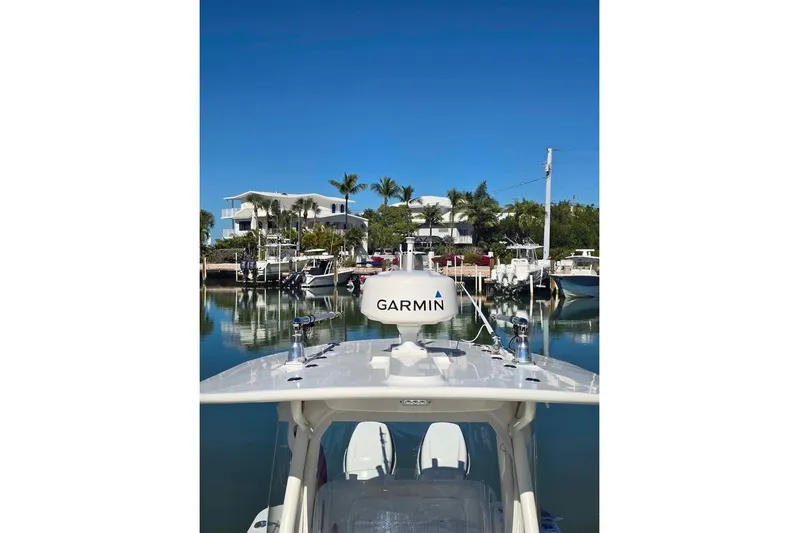  Yacht Photos Pics 2017 Regulator 25 boat with Garmin equipment docked in a scenic marina.