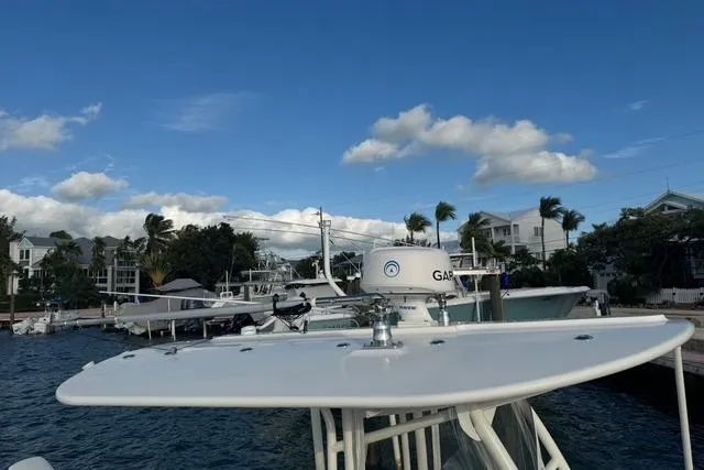  Yacht Photos Pics 2017 Regulator 25 boat docked at marina under clear blue sky.